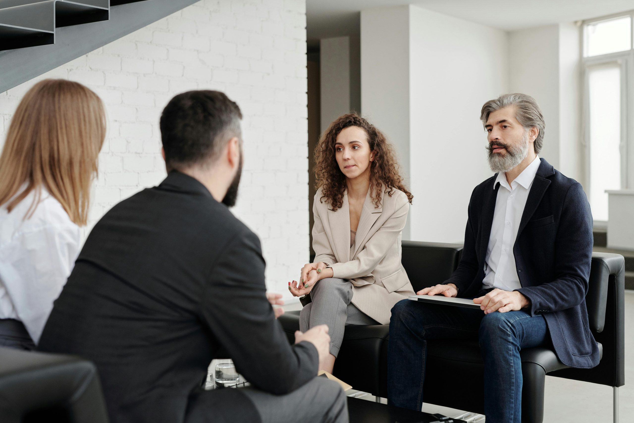 HOA management team meeting with homeowners to discuss community updates.