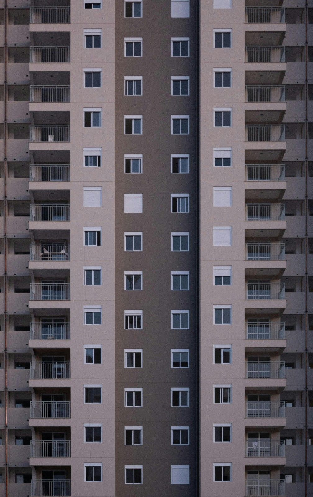 Exterior view of a modern condo building with balconies and multiple residential units, representing condo association management.