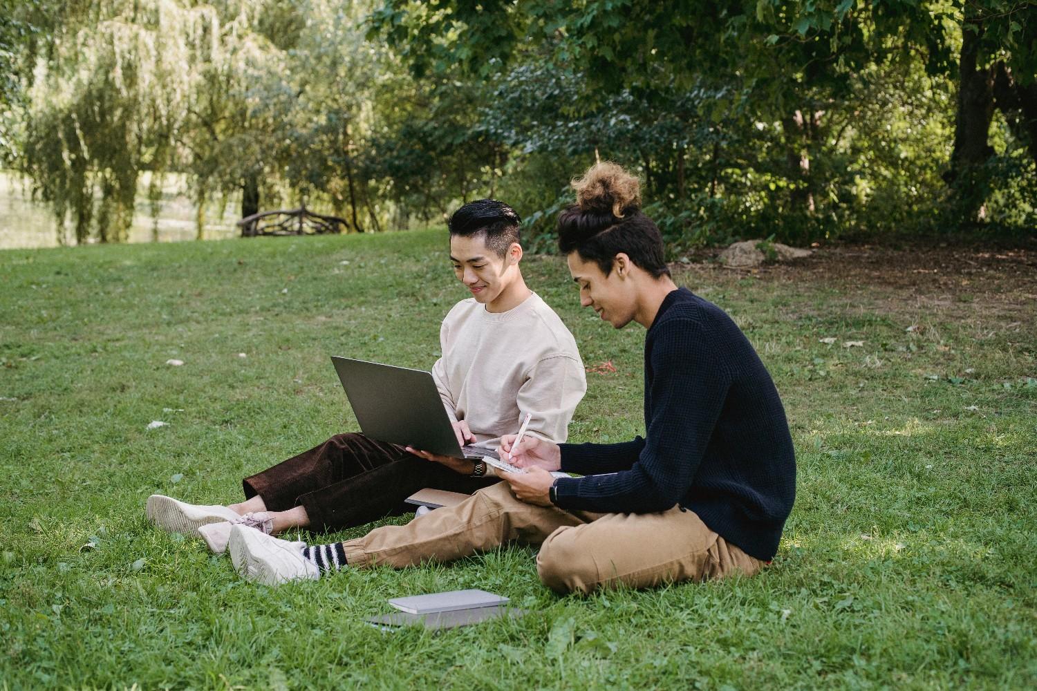 Two residents working together in a shared outdoor space, reflecting condo association management and community collaboration.