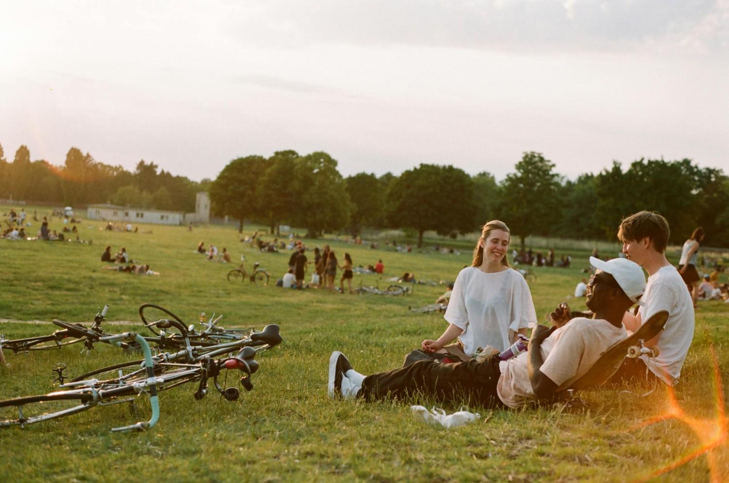 Residents relaxing in a community park, highlighting an active and welcoming HOA neighborhood.