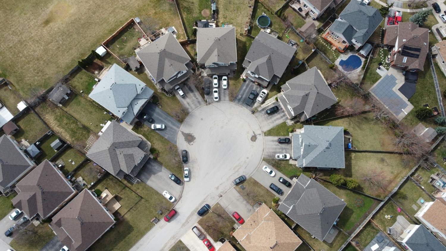 Aerial view of a residential neighborhood highlighting organized streets and professionally managed HOA homes.